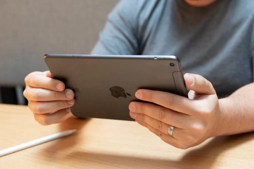 Man playing on iPad Charger